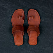 Tan Patent Kolhapuri Flats With Glossy Finish