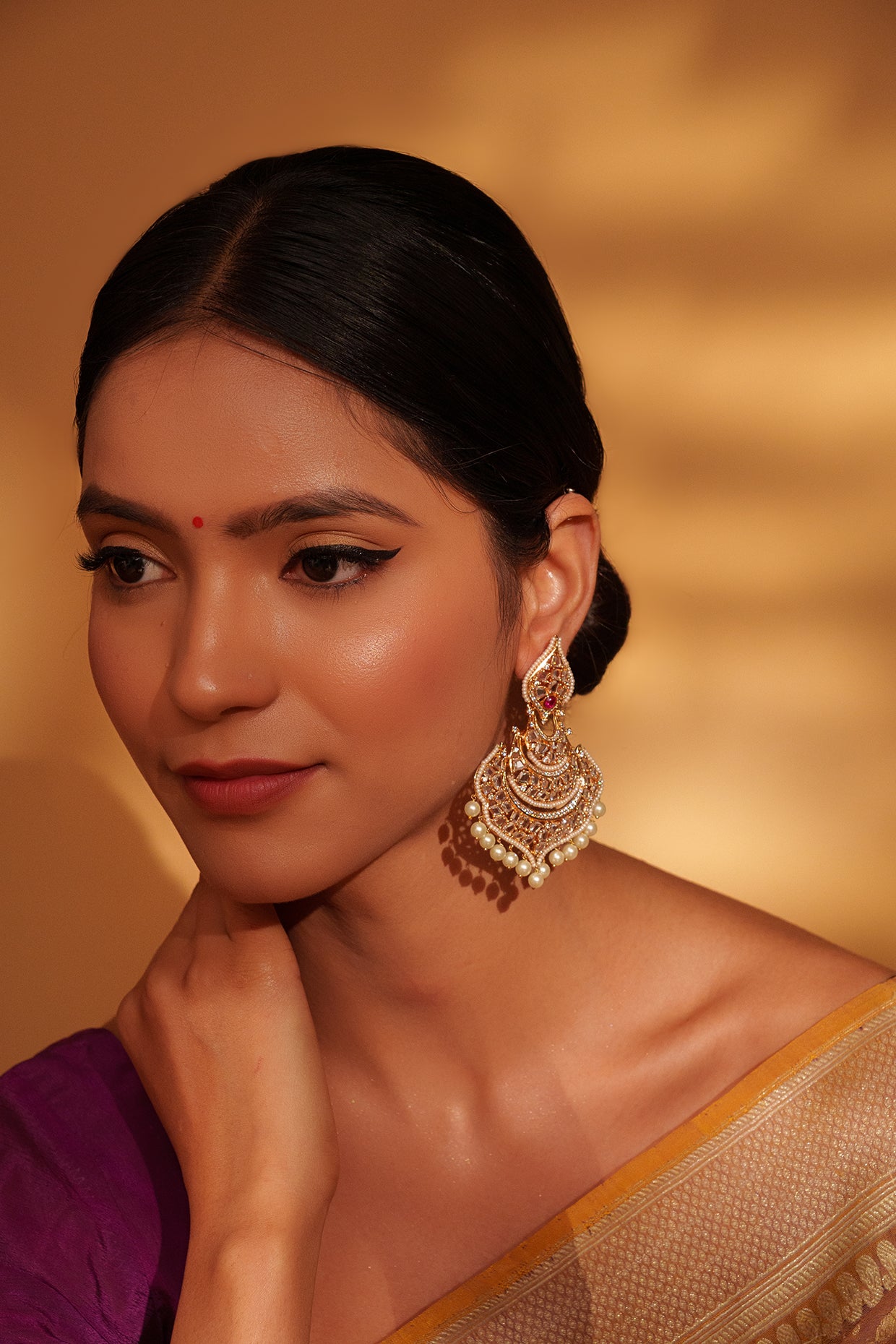 Festive Gold Chandbali Earrings with Kundan and Pearl Accents